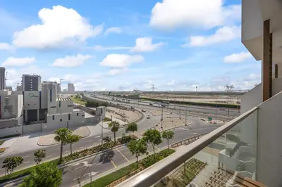 a view from a balcony of a city street at Elite Escape - Getaway in Azizi Riviera 29 in Dubai