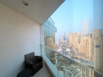 a balcony with a view of a city at Beachfront Luxury Penthouse at The Walk JBR next to Bluewaters Island - 2BR & Maids Room in Dubai
