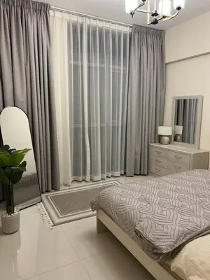 a bedroom with a bed and a large window at Amazing 1BR Full Burj View in Dubai