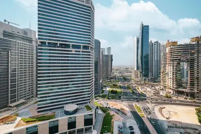 an aerial view of a city with tall buildings at Canal Walk Luxury Studio Central Business Bay in Dubai