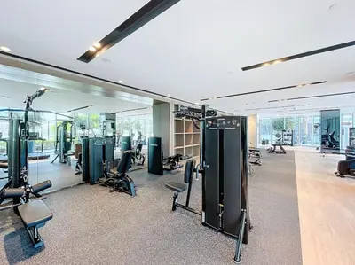 a gym with treadmills and exercise equipment in a building at Vacationer l Fountain, Burj Khalifa View l 2 Bedroom l Downtown Dubai in Dubai