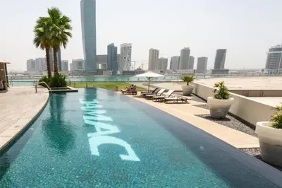 a swimming pool on the roof of a building at Vacationer l Stylish 1 Bedroom l Downtown Dubai l Pool, Gym Access in Dubai