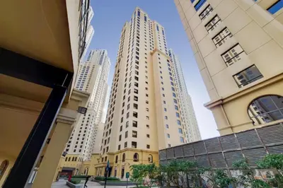 two tall buildings in the middle of a city at Vacationer I Upgraded Studio I Heart of JBR I Near JBR Beach, Cafes & Restaurants in Dubai