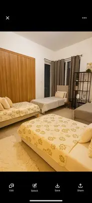 a room with three beds sitting on the floor at Accommodation for girls only in Dubai
