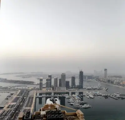 an aerial view of a city with boats in the water at Accommodation for girls only in Dubai