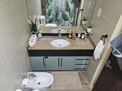 a bathroom with a sink and a toilet at JLT Studio, Steps to Metro, High floor, Smart Home in Dubai