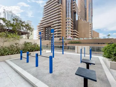 a group of blue poles in front of some buildings at Exquisite Marina Home with Panoramic Yacht Views in Dubai