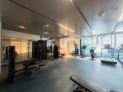 a gym with cardio equipment and a large window at Modern Retreat at Azizi Azure, Meydan in Dubai