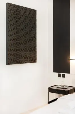 a bedroom with a table and a picture on the wall at Opera Grand Sky Luxurious 3-Bedroom Apartment in Downtown Dubai with Panoramic Burj Khalifa View in Dubai