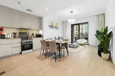 a kitchen and dining room with a table and chairs at Creek Beach Sunset 3! Lagoon Access! in Dubai