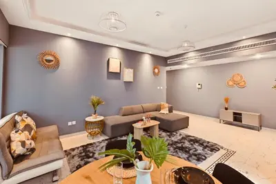 a living room with a couch and a table at Luxury Retreat Your High Floor Heaven in Marina in Dubai