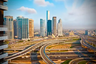 a busy freeway in a city with tall buildings at Luxury Retreat Your High Floor Heaven in Marina in Dubai