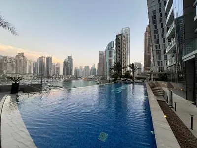 a large swimming pool in the middle of a city at Lavish Marina Gem - Dubai Eye Views - Infinity Pool in Dubai