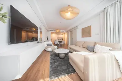 a living room with a couch and a table at StayShort - Sophisticated unit in JLT Sleeps 6 with Lake Views in Dubai