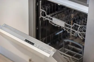 a dishwasher with a rack of chickens in it at Luxury 2 Bedroom Apartment with Maids Room and Large Terrace in Dubai