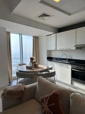 a living room with a couch and a table at Stunning 1-Bedroom Apartment , Full Marina View in Dubai