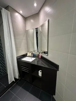 a bathroom with a sink and a mirror at Stunning 1-Bedroom Apartment , Full Marina View in Dubai