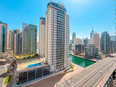 a city skyline with a tall building and a highway at Chic Stay in Sparkle Towers in Dubai