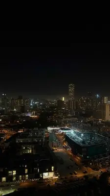 a city lit up at night with a city at Modern & Fully Furnished 1BR in Heart of JVC in Dubai