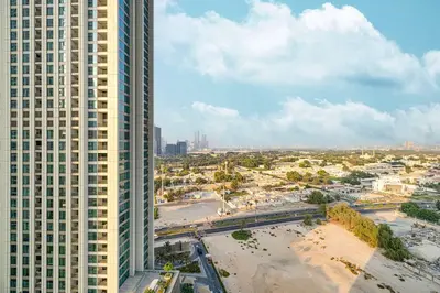an aerial view of a city with tall buildings at Luxury 2BR Downtown Dubai Near Dubai Mall in Dubai