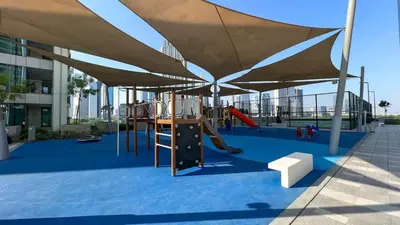 a playground with a canopy and a slide at Elegant 2BR Downtown Dubai Walk to Dubai Mall in Dubai