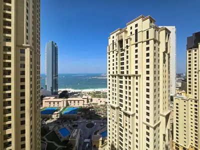 a view of a city with tall buildings and the ocean at Elegant and Spacious 3-bedroom in JBR in Dubai
