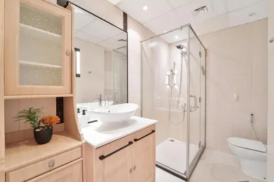 a bathroom with a sink and a shower and a toilet at Elegant and Spacious 3-bedroom in JBR in Dubai