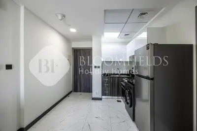 a hallway of an office building with a refrigerator at Bloomfields Cozy 1br In Rukan in Dubai