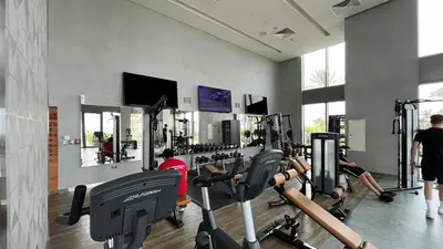 a gym with a bunch of treadmills and machines at Premium Corner 3BR, Sea Views with Sunset, 85 inch TV in Dubai