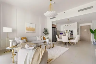 a living room with a couch and a table at Silkhaus Lavish 2BDR Retreat at Dubai Creek Harbour in Dubai