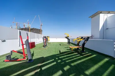a balcony with exercise equipment on a ship at Bright studio oplaz by Danube Near Miracle Garden in Dubai