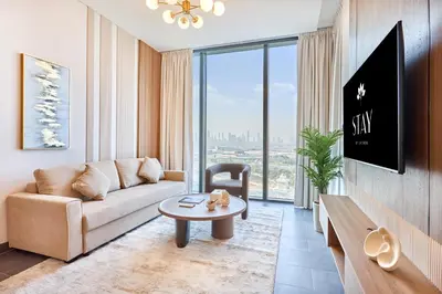 a living room with a couch and a table at STAY BY LATINEM Luxury 2BR Holiday Home CB 1215 Near Burj Khalifa in Dubai