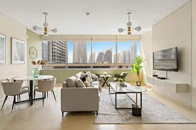 a living room with a couch and a table at Silkhaus Premium 1BDR Stay with DIFC Views in Dubai