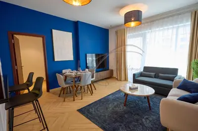 a living room with a couch and a table at Full Burj Khalifa and Fountain Views 2BHK Apartment by WS Holiday Homes in Dubai