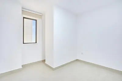 a room with a white wall and a window at Modern 3BR in Rimal 5, JBR Dubai in Dubai