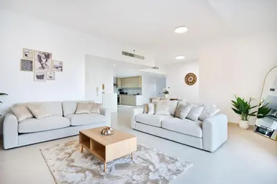a living room with two couches and a coffee table at Modern 3BR in Rimal 5, JBR Dubai in Dubai