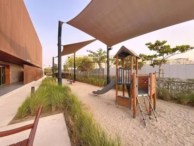a playground with a slide and a play structure at Locations l Upgraded 1 Bedroom l Sea Views, Beach Access l Port de La Mer in Dubai