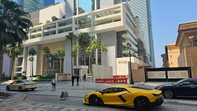 a yellow car parked on a street in a city at GYL Holiday Homes I Spacious 4 BDR Apt in JBR Beach, Dubai eye & Marina I Unbeatable location in Dubai