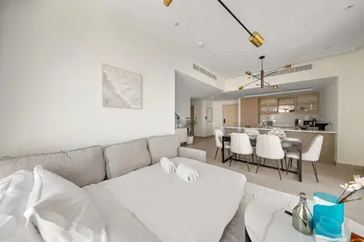 a living room with a couch and a table at FIRST CLASS 2BR Burj and Fountain Cozy Luxe in Dubai