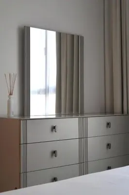 a mirror on top of a dresser in a bedroom at Madinat Jumeirah Living in Dubai