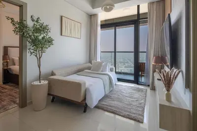 a bedroom with a bed and a large window at Frank Porter - Aykon City 2 Tower C in Dubai