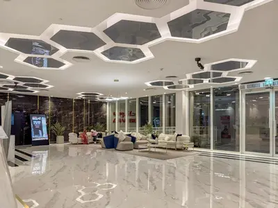 a lobby with couches and tables in a building at FIRST CLASS Studio Chic and Comfy in Jewelz in Dubai