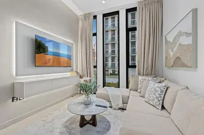 a living room with a couch and a table at FIRST CLASS 1BR Elegant Living with City Views in Dubai