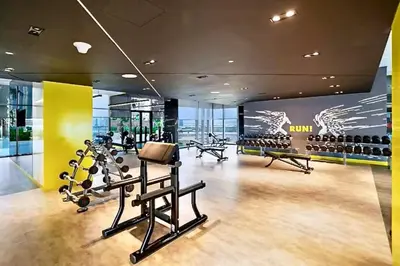 a gym with treadmills and exercise equipment in a building at Vogue Business Bay Aykon City Tower Close to Downtown Burj Khalifa and Dubai Mall, Two Bedroom Apartment with Large Balcony Sea view, Access to all Amenities in Dubai