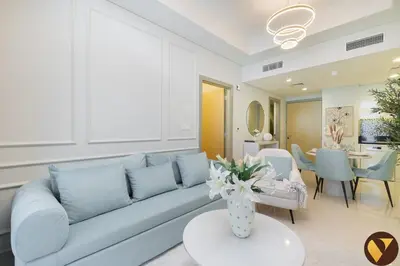 a living room with a couch and a table at Vogue Business Bay Aykon City Tower Close to Downtown Burj Khalifa and Dubai Mall, Two Bedroom Apartment with Large Balcony Sea view, Access to all Amenities in Dubai