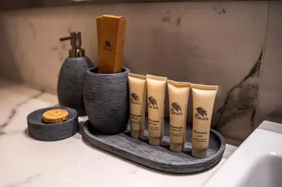 a group of bamboo sticks in a holder in a bathroom at Airstay - Modern 1BR - Pool Views - Azizi 61 - Monthly Offer Available in Dubai