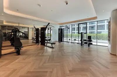 a gym with treadmills and exercise equipment in a building at Airstay - Modern 1BR - Pool Views - Azizi 61 - Monthly Offer Available in Dubai