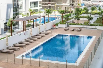 an overhead view of a swimming pool on top of a building at Airstay - Modern 1BR - Pool Views - Azizi 61 - Monthly Offer Available in Dubai