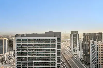 a view of a large building in a city at FIRST CLASS 1BR Modern Serenity , Near Downtown in Dubai