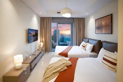 a hotel room with two beds and a window at Luxury 2B Burj Khalifa NYE Views, 5-Star Amenities in Dubai